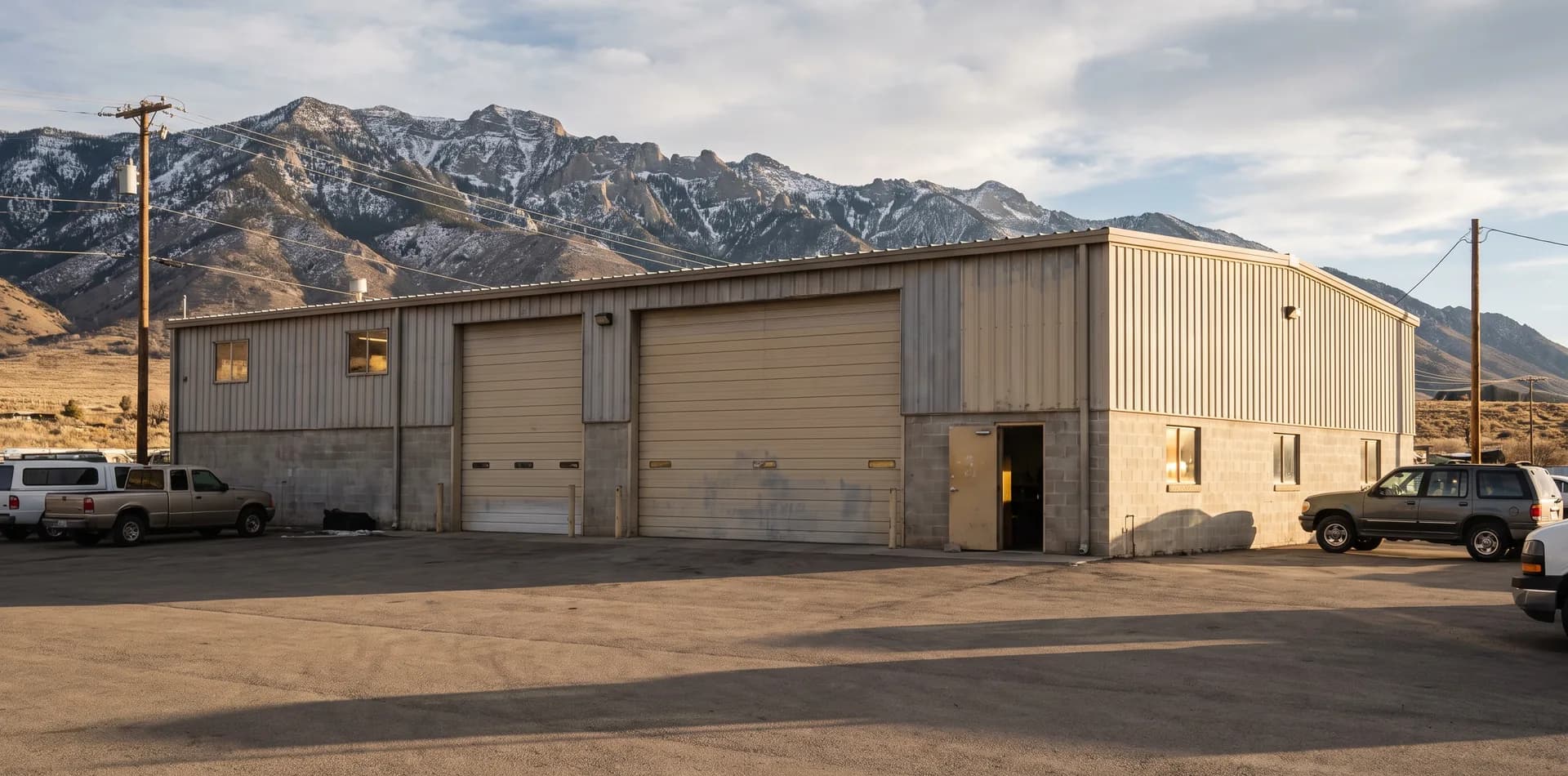 exterior of a collision repair shop in a mountain setting